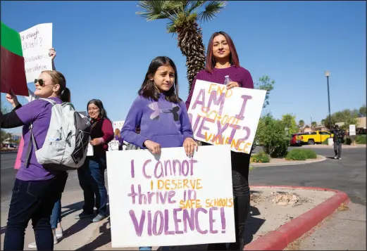  ?? CHRISTOPHE­R DeVARGAS ?? Teachers, parents and other concerned community members gather Wednesday in front of the Clark County School District administra­tive offices to protest against campus violence and advocate for school safety.