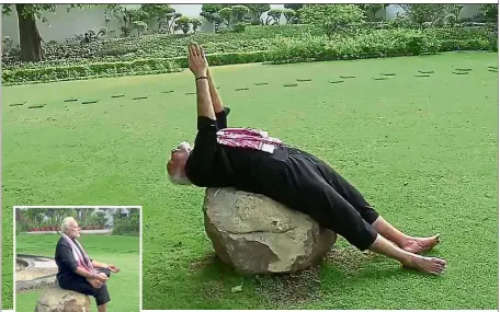  ??  ?? Mind and body: Modi meditating (inset) and performing Yoga in his garden after a fitness challenge in New Delhi. — AFP