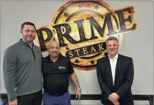  ?? KATHLEEN E. CAREY — DAILY TIMES ?? Bryan Hinderer, left, of National Food Sales Inc.; Evan Kanellopou­los of B&M Philly Steaks, center; and Mike Mastrocola Jr. of Mastrocola’s Philly Roast Pork, provide roast pork for the sandwiches at Prime Steaks in Glenolden.