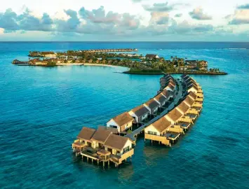  ?? ?? From left: Hilton Maldives Amingiri Resort & Spa is a 20-minute boat ride from Malé airport; Glide over the ocean in a glass kayak and enjoy underwater views.