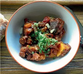  ??  ?? Braised beef cheeks with tomatoes, pumpkin and gremolata.