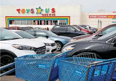  ?? [PHOTOS BY JIM BECKEL, THE OKLAHOMAN] ?? The Toys R Us store at 1119 SE 66 in Oklahoma City marked down its inventory to prepare for the store’s closing. Shoppers took advantage of the deep discounts, making purchases there Friday afternoon.