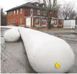  ?? ALLEN MCINNIS ?? Anti-flooding equipment has been set up on Gouin Blvd. With social distancing protocols in effect, assembling armies of volunteers for sandbaggin­g duties will not be feasible this year, Pierrefond­s-roxboro mayor Jim Beis says.