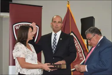  ?? NICHOLAS BUONANNO — MEDIANEWS GROUP ?? Joseph Centanni takes the oath as the 19th Watervliet police chief. Mayor Charles Patricelli reads the oath, right, as Centanni’s wife, Diana Centanni, looks on.