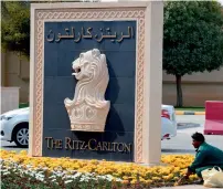  ?? AFP ?? A labourer working outside the main entrance of the Ritz Carlton hotel in Riyadh following its reopening. —