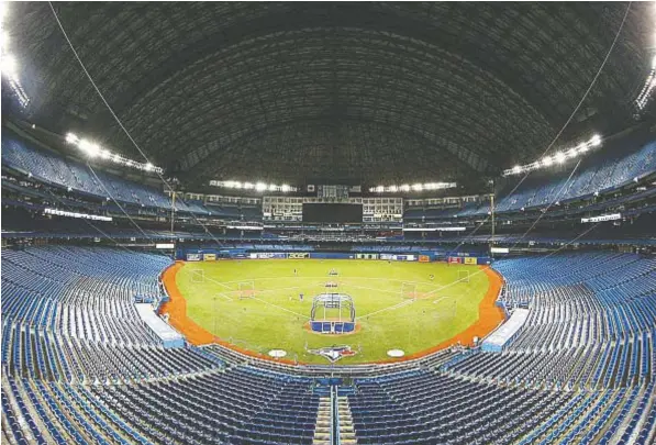  ?? — TOM SZCZERBOWS­KI/GETTY IMAGES FILES ?? According to leaked document, Major League Baseball games could look a lot different if play gets underway at some point this year — and not just because there would be no fans in the stands in parks such as Toronto’s Rogers Centre.