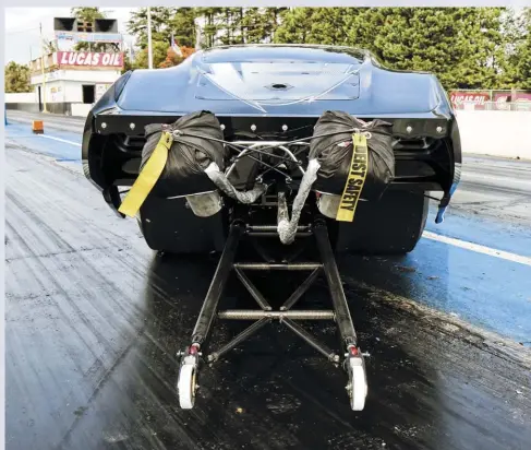  ??  ??  Simpson Racing Products parachutes are employed to bring the car down from terminal velocity at the end of each pass.