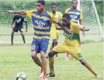  ??  ?? Rusea’s’ Nazime Matalie (left) shields the ball from Knockalva’s Rushean Henderson during a recent ISSA-FLOW daCosta Cup match.