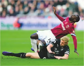  ??  ?? Crunch...Pedro Obiang of West Ham United feels the full force of a sliding tackle from Burnley defender Ben Mee