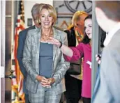  ?? JAN-MICHAEL STUMP/AP ?? Secretary Betsy DeVos decided in 2017 to give debt relief to former Corinthian students by comparing the average earnings of students in similar vocational programs.