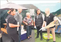  ??  ?? COUNCILLOR Alison Franklin talks to Clive and Shirley Boyden at the Central Districts Field Days Tararua Country stand with council staff Amiria Tautu- Bristowe and Mercedes Waitere.