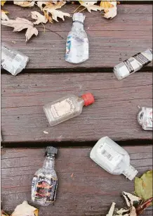  ?? Judy Benson / Connecticu­t Sea Grant / Contribute­d photo ?? Empty nips bottles collected on a recent walk in a residentia­l neighborho­od in New London. A first-in-the-nation stewardshi­p program places a 5-cent environmen­tal fee on the sale of each nip container sold in Connecticu­t.