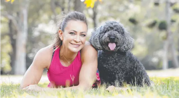  ?? Picture: JUSTIN LLOYD ?? Michelle Bridges, with Milton, from the Black Dog Institute at Rushcutter­s Bay, knows the benefits of exercise on mood.