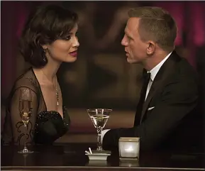  ??  ?? COCKTAIL HOUR: Berenice Marlohe and Daniel Craig in Skyfall