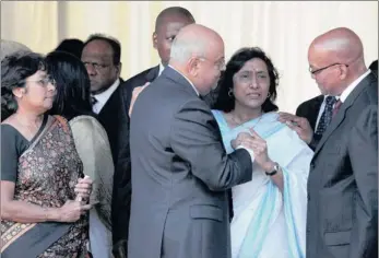  ??  ?? President Jacob Zuma and Finance Minister Pravin Gordhan offer their condolence­s to Sally Mudly-padayachie at the funeral.