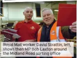  ?? ?? Royal Mail worker David Strattin, left, shows then MP Bob Laxton around the Midland Road sorting office