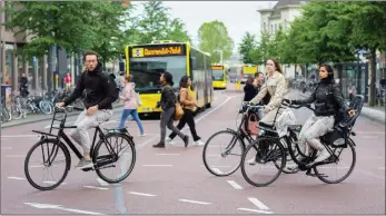  ?? ?? Cities such as Amsterdam, above, Copenhagen and Paris have reprioriti­sed road space to make active travel easier