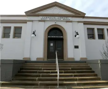  ?? Pam Panchak/Post-Gazette ?? The Carnegie Library of Pittsburgh’s Mount Washington branch has undergone a yearlong renovation project that includes a rear addition. The building’s historic facade is not changed.