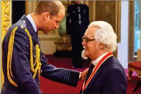  ??  ?? PROUD DAY: Billy is knighted by Prince William at Buckingham Palace