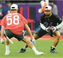  ?? DOUG BENC/AP ?? Running back Saquon Barkley of the New York Giants attempts to run the ball past outside linebacker Matt Milano of the Buffalo Bills during the flag football event at the Pro Bowl Games.