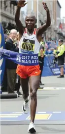  ??  ?? Geoffrey Kirui, of Kenya, crosses the finish line to win the 121st Boston Marathon