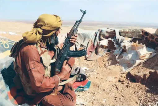  ?? AFP ?? An opposition fighter belonging to National Liberation Front in southwest
Idlib province as the Russian Defense Ministry urges insurgent factions to join the cease-fire.