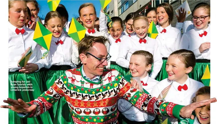  ??  ?? Jumping for joy: Ryan Tubridy with young hopefuls in Limerick yesterday