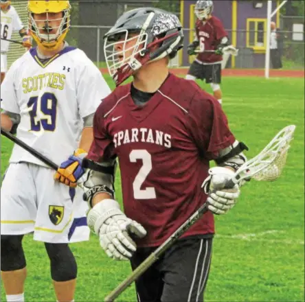  ?? NICK TOPPING— NTOPPING@DIGITALFIR­STMEDIA.COM ?? Burnt Hills’ Jacob Stanko works the ball across the field during his teams 11-10 win over Ballston Spa on Thursday.