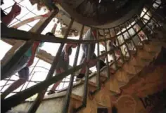  ??  ?? A group of tourists visit a former Syrian army post in Quneitra.