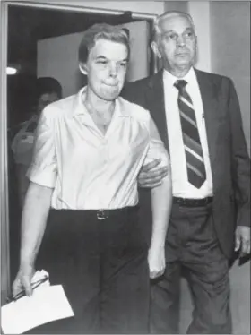  ?? AP FILE ?? Marybeth Tinning is led into Schenectad­y County Court by county Sheriff Bernard Waldron in October 1987.