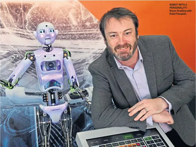  ??  ?? ROBOT WITH A PERSONALIT­Y: Bryan Snelling with RoboThespi­an.
