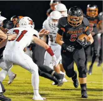  ?? STAFF FILE PHOTO BY ROBIN RUDD ?? South Pittsburg’s Garrett Raulston breaks loose for a touchdown during a home game against Whitwell in Region 3-1A play last October. The host Pirates held on for a seven-point victory.