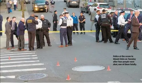  ?? ?? Police at the scene in Mount Eden on Tuesday after four people were shot, one of them fatally.