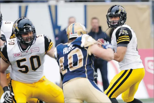  ?? — PHOTOS: THE CANADIAN PRESS FILES ?? Hamilton Tiger-Cats quarterbac­k Zach Collaros is at his best when he’s making plays with his feet and being creative. ‘He’s a competitor and he’s the guy you want manning the quarterbac­k position,’ Stampeders head coach/GM John Hufnagel says.