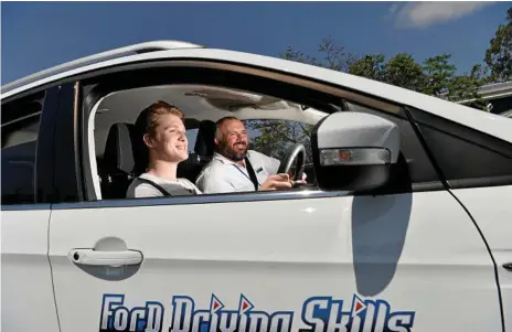  ?? Photo: Kevin Farmer ?? LIFE SKILLS: Student driver Hayden Urquhart (left) learns from instructor James Stewart during the Ford Driving Skills For Life program at Toowoomba Kart Club‘s Greer Park Raceway.