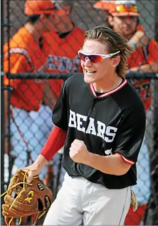  ?? JOHN STRICKLER - DIGITAL FIRST MEDIA ?? Above, Boyertown’s Michael Raineri celebrates after doubling up Perkiomen Valley in the bottom of the second inning to end a rally. At left, Bears catcher Ryan Weller shows the umpire that he held onto the ball after tagging out Perkiomen Valley’s Joe...