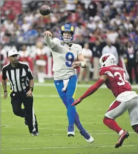  ?? John Cordes Associated Press ?? MATTHEW STAFFORD didn’t throw a touchdown pass against the Cardinals on Sunday, but he also didn’t throw an intercepti­on for the first time this season.