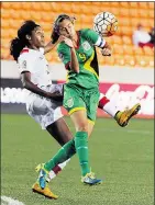  ??  ?? Canada’s Ashley Lawrence, left, and Guyana’s Ashley Rodrigues go after the ball during a match on Thursday night.