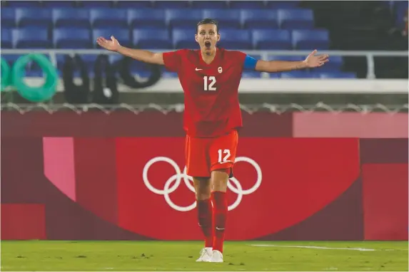  ?? ADRIAN WYLD/THE CANADIAN PRESS ?? Christine Sinclair protests a call during Canada's win over Sweden in the Olympic final. She says she's undecided about her future in internatio­nal play.