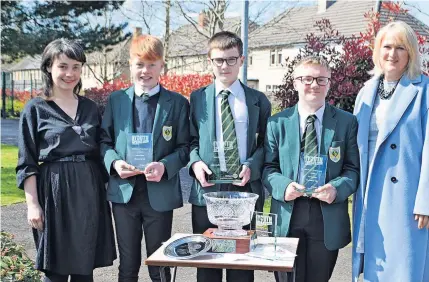  ?? ?? Top class St John Ogilvie pupils (from second left) Louie Bonnar, Lucas Quinn and Matthew Robertson, with principal teacher Rowan Martin (left) and head teacher Lorna Lawson