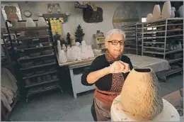  ?? Genaro Molina Los Angeles Times ?? CAREER DEFIED EXPECTATIO­NS The Boyle Heights-born Dora De Larios in her studio in 2014. Her ceramic art forms were inspired by her Mexican heritage and ancient Japanese design.