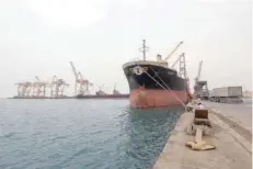  ??  ?? A ship carrying a shipment of grain is docked at the Red Sea port of Hodeidah, Yemen. — Reuters