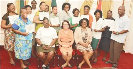  ??  ?? In photo sitting, left to right are course facilitato­r, Warrant Officer Weslyn Boodie, First Lady, Sandra Granger and Lt. Col. (ret’d) Yvonne Smith with the staff of State House (Ministry of the Presidency photo).