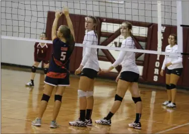  ?? Terrance Armstard/News-Times ?? Twin Towers: West Side Christian seniors, Lauren Land, left, and Anna Williams, wait at the net for the opposing serve. The Lady Warriors open the regular season Tuesday in Malvern against Ambassador Baptist.