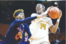  ?? AP PHOTO/JOY KIMBROUGH ?? Tennessee guard Zaay Green drives to the basket against Auburn during the second quarter of Thursday’s game in Knoxville.