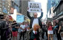  ?? PHOTO: REUTERS ?? A demonstrat­or takes part in a protest in New York City’s Times Square against US President Donald Trump’s announceme­nt that he plans to reinstate a ban on transgende­r individual­s serving in the US military.