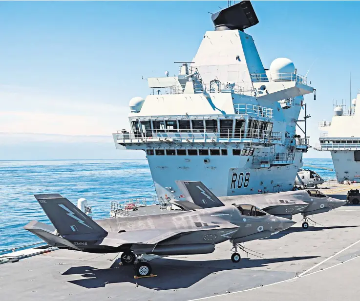  ?? ?? Jumpjets: F-35Bs on the flight deck of the aircraft carrier HMS Queen Elizabeth