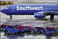  ?? MATT YORK - THE ASSOCIATED PRESS FILE ?? A Southwest Airlines jet arrives Dec. 28at Sky Harbor Internatio­nal Airport in Phoenix. The December meltdown at Southwest led to nearly 17,000cancele­d flights over the holidays.