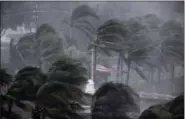  ?? DAVID GOLDMAN — THE ASSOCIATED PRESS ?? An American flag is torn as Hurricane Irma passes through Naples, Fla., Sunday.