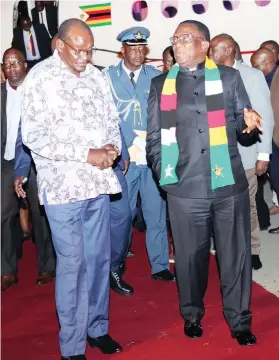  ?? — Picture Justin Mutenda ?? President Mnangagwa chats with Vice President Kembo Mohadi at Robert Gabriel Mugabe Internatio­nal Airport in Harare on Saturday on his arrival from Democratic Republic of Congo where he witnessed the inaugurati­on of President Felix Tshisekedi who was reelected for a second term. The President went to DRC after attending the Non-Aligned Movement and G77 plus China summits in Uganda.